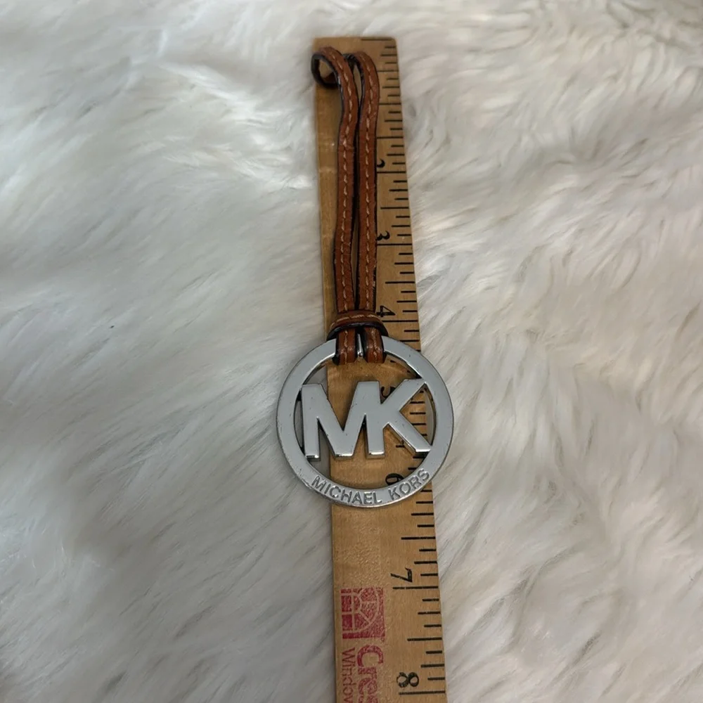 Michael Kors Fob Hang Tag Silver Color Metal Logo on Cognac Brown Leather Strap